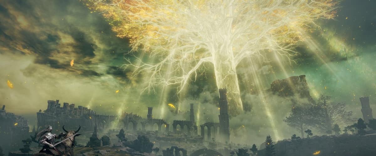Un cavalier contemple l'Arbre-Monde doré qui illumine le ciel au-dessus des ruines de l'Entre-terre