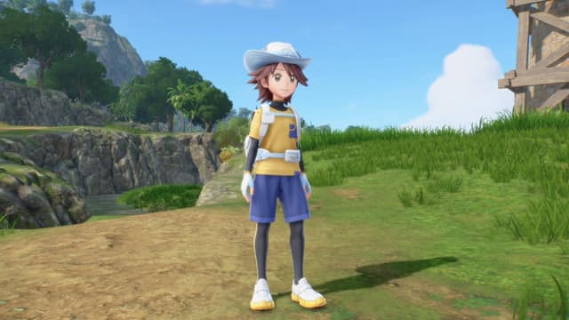 Le personnage principal de Pokémon Vents et Pokémon Vagues debout sur un sentier herbeux, falaises et arbres en arrière-plan