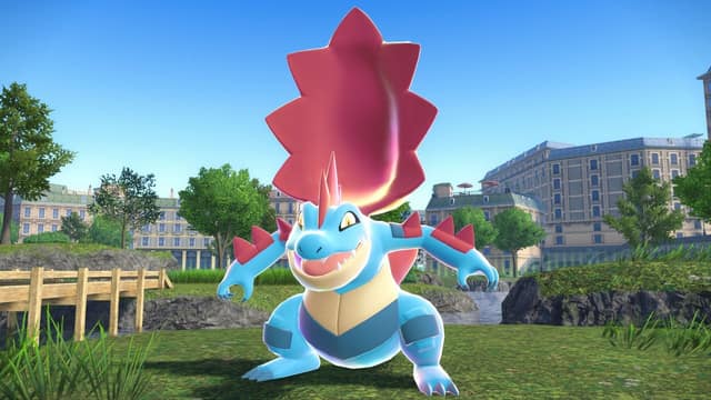 Méga-Aligatueur dans un parc d'Illumis, immeubles haussmanniens en arrière-plan, dans Légendes Pokémon : Z-A