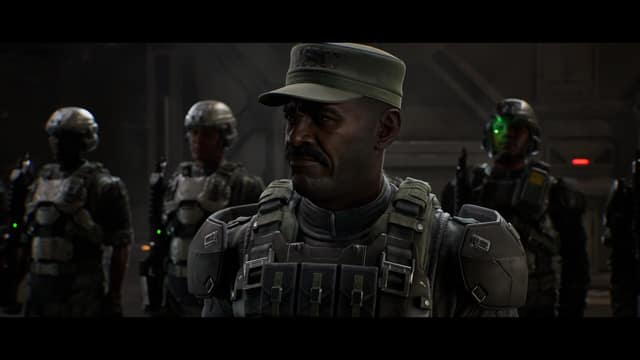 Le sergent Johnson, casquette et gilet pare-balles, devant un groupe de marines dans Halo: Campaign Evolved
