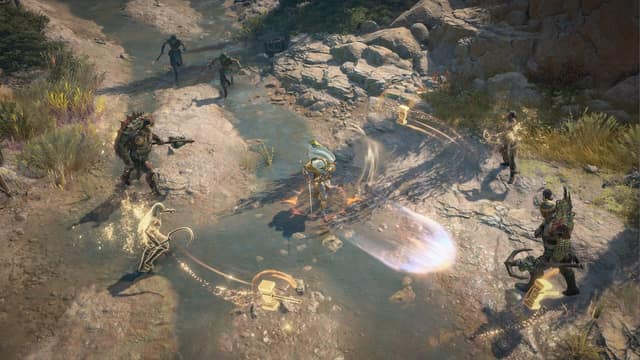 Un personnage déchaîne des attaques de lumière dorée face à des guerriers au bord d'un ruisseau dans Diablo IV: Lord of Hatred