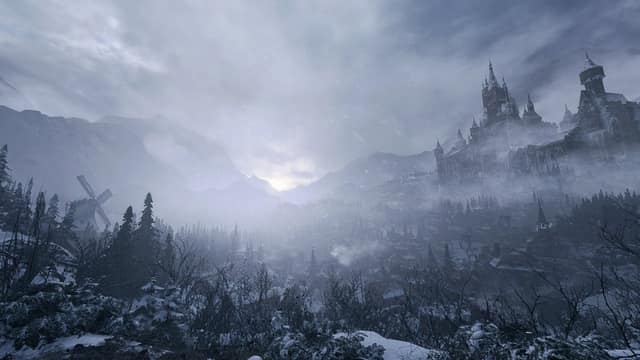 Un village enneigé dans une vallée brumeuse, dominé par un château, dans Resident Evil Village