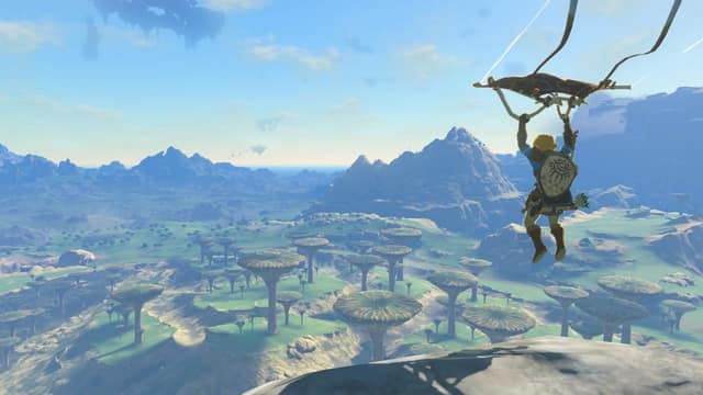 Link descend en paravoile au-dessus des plaines d'Hyrule dans Tears of the Kingdom