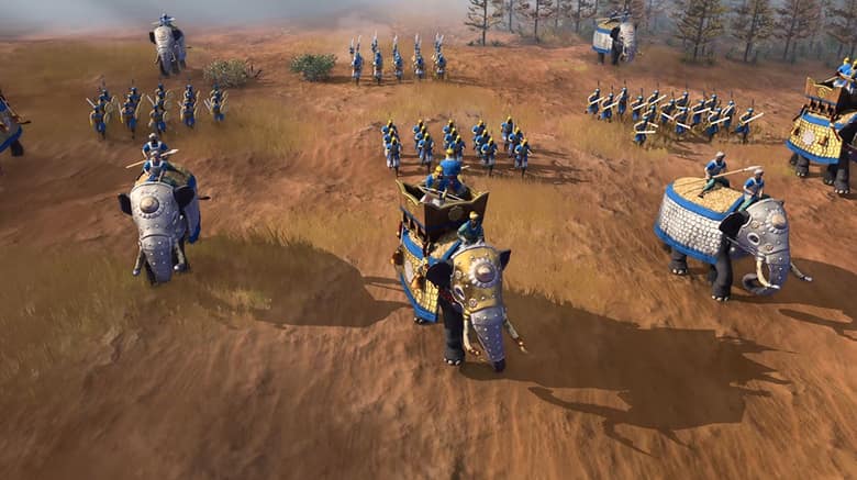 Age of Empires IV : de la cavalerie lourde traverse une plaine ocre
