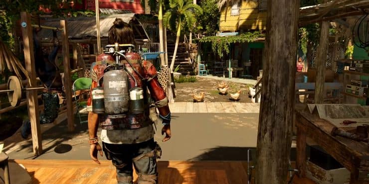 Far Cry 6 : un guérillero au lance-flammes traverse un village sur pilotis