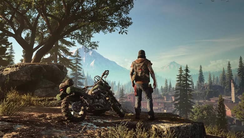 Days Gone : Deacon et sa moto en surplomb d'une vallée boisée de l'Oregon