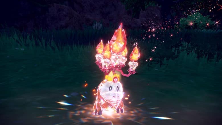 Chochodile téracristallisé dans Pokémon Écarlate et Violet : son corps prend un aspect de cristal et une couronne de bougies enflammées apparaît sur sa tête