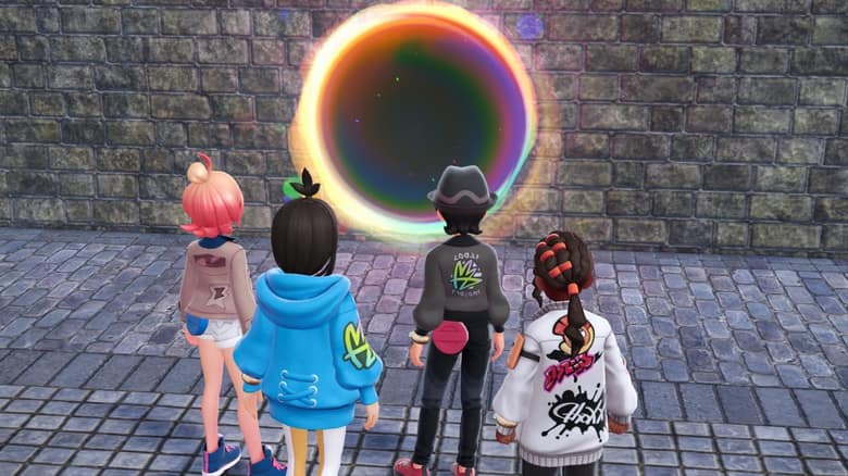 Quatre membres de la Team MZ, vus de dos, face à un anneau lumineux aux couleurs d'arc-en-ciel ouvert sur un mur de pierre
