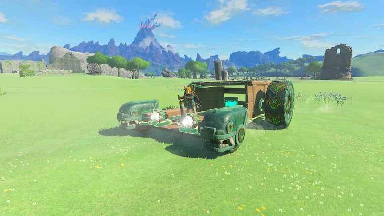 Link aux commandes d'un véhicule à roues assemblé avec Emprise, dans une plaine d'Hyrule