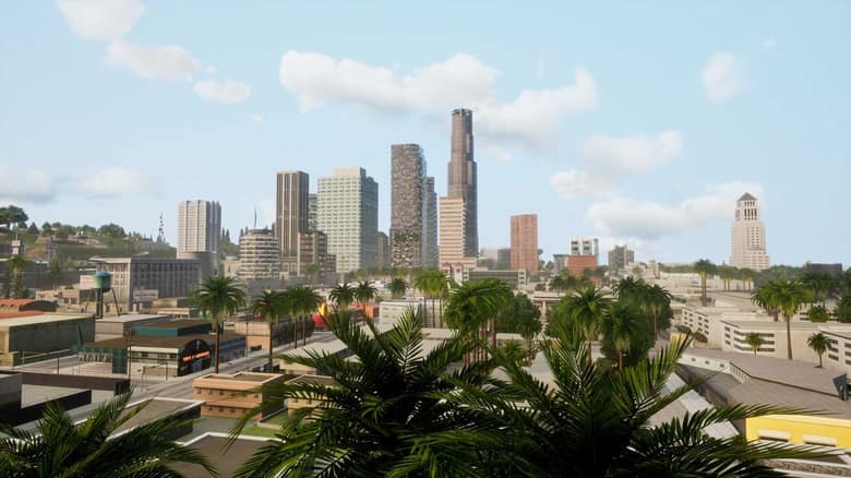 Vue de Los Santos dans GTA San Andreas Definitive Edition, avec des palmiers au premier plan et les gratte-ciel du centre-ville