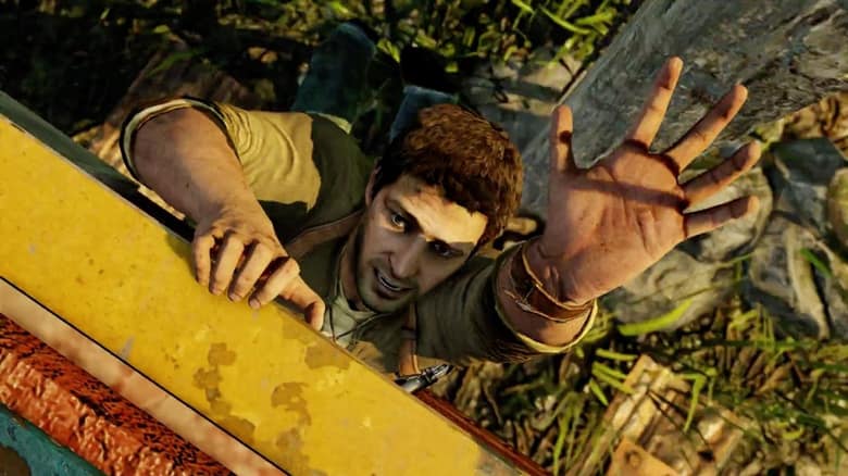 Nathan Drake s'agrippe à une poutre jaune au-dessus du vide