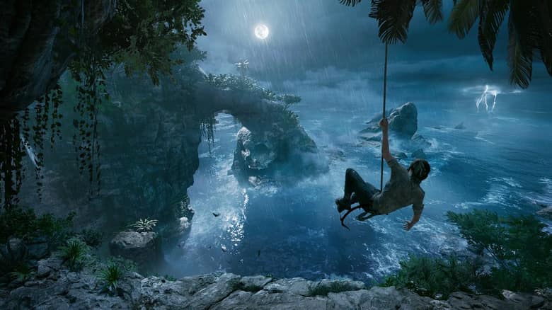 Lara Croft se balance au bout d'une corde au-dessus d'une côte rocheuse sous l'orage