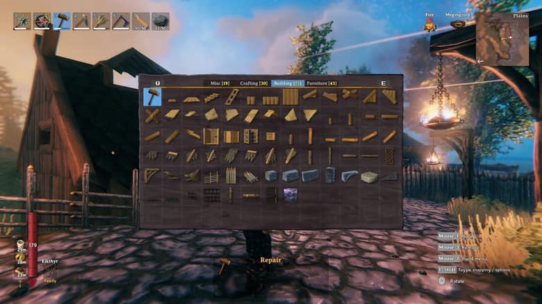 Le menu de construction de Valheim ouvert devant une maison en bois, avec les murs, toits et portes disponibles