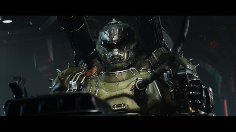 Le Doom Slayer en armure verte et casque fermé, assis aux commandes d'un engin dans une salle sombre