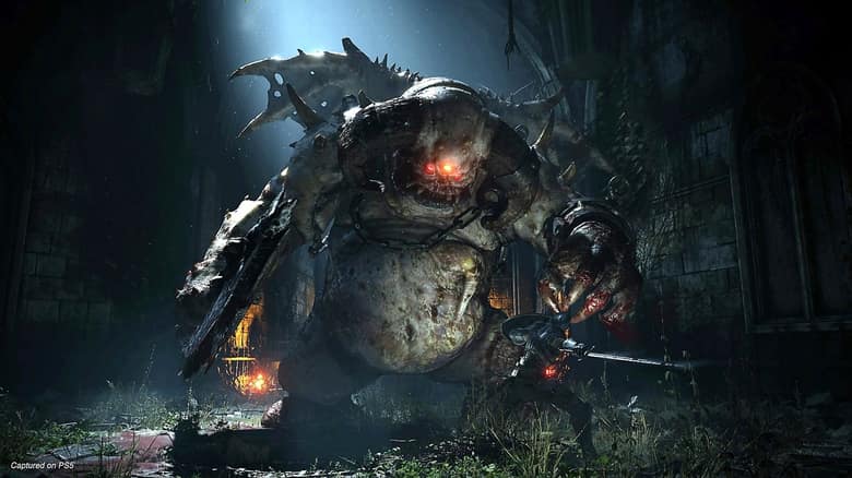 Demon's Souls : un chevalier face à un démon colossal dans un donjon sombre