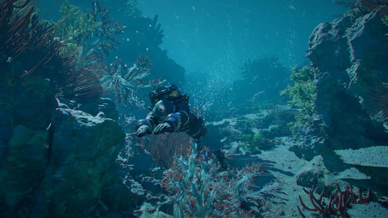 Capture officielle de Crimson Desert Charting the Unknown : un plongeur en combinaison explore des fonds marins couverts de coraux